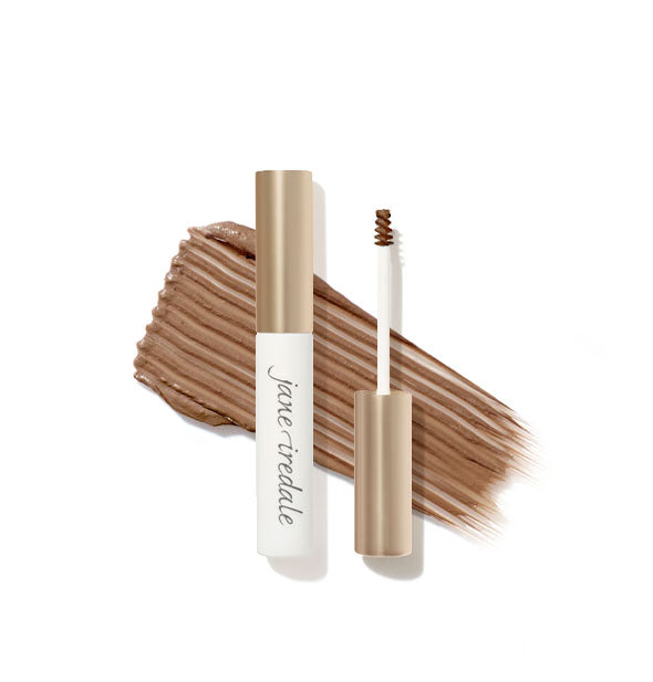 White and gold Jane Iredale brow gel tube with spoolie applicator shown features a product sample application behind in Ash Blonde