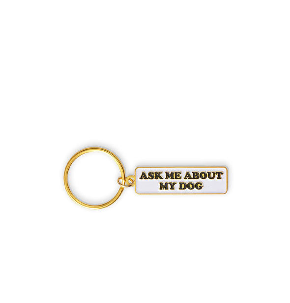 Rectangular white enamel keychain with gold edging and ring says, "Ask me about my dog" in black lettering