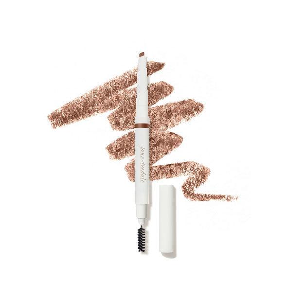 White Jane Iredale brow pencil with cap removed to show angled tip on top and spoolie brush on bottom is placed in front of a drawn squiggle of product in shade Auburn