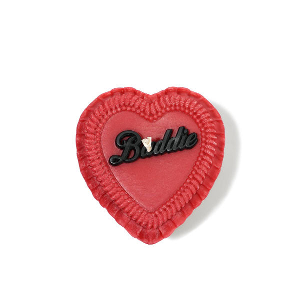 Red heart-shaped candle designed as an iced cake with the word, "Baddie" on top in black script lettering