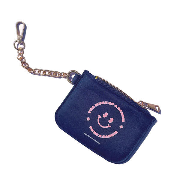 Navy blue zippered pouch with gold chain and clasp attached features a central pink smiley face around which the phrase, "Too much of a baddie to be a saddie" in pink lettering forms the outline of the smiley face