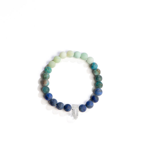 Beaded bracelet with green and blue stones accented with a central clear crystal point