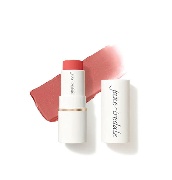 White tube of Jane Iredale Glow Time Blush Stick with cap removed and sample product application behind in matte shade Balmy