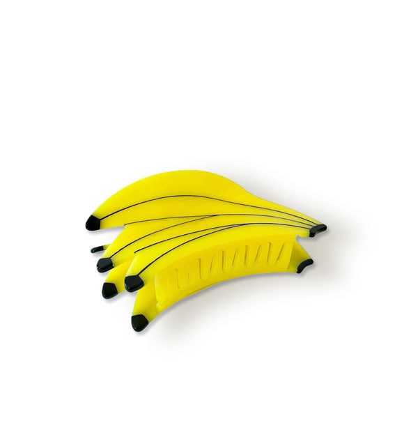 Hair clip shaped and painted to resemble a bunch of bananas
