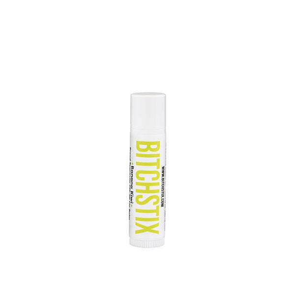 White tube of Bitchstix lip balm with lime green lettering