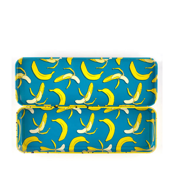 Rectangular box interior features a print of bananas both peeled and unpeeled on a teal background