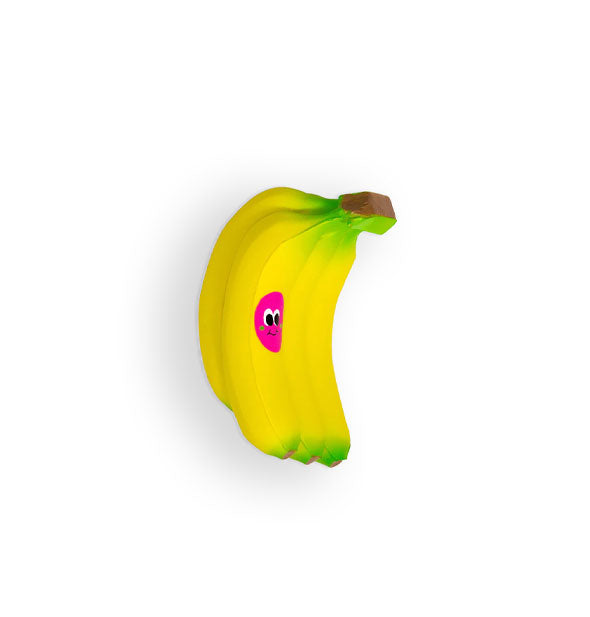 Foam toy is designed to resemble a bunch of bananas with pink smiley face sticker on one