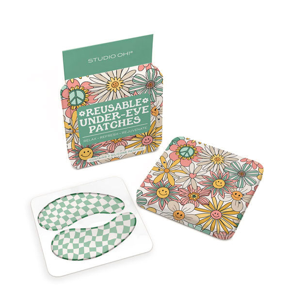Contents of the Beamin' Blooms edition of Studio Oh! Reusable Under-Eye Patches: green and white wavy checker print patches and smiley face floral print square storage tin
