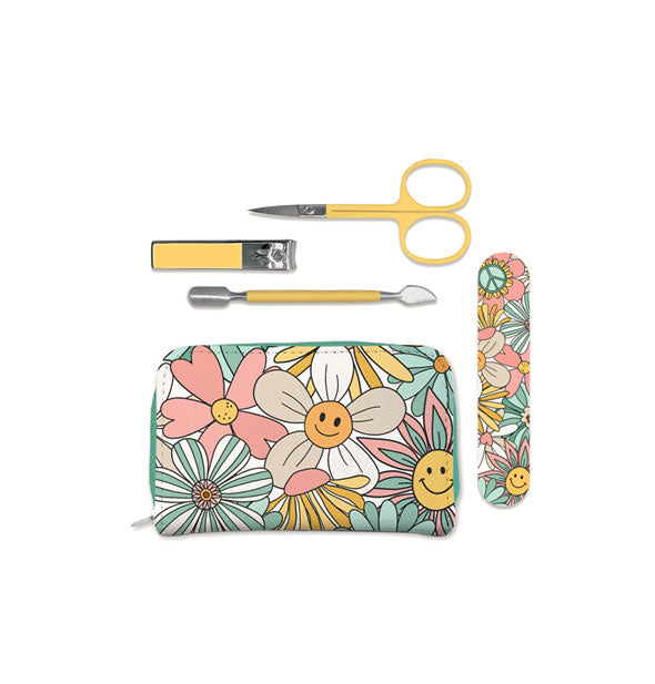 Manicure kit with whimsical smiley face flower print on zipper pouch and nail file; also included are a pair of yellow-handled clipper, cuticle pusher, and scissors
