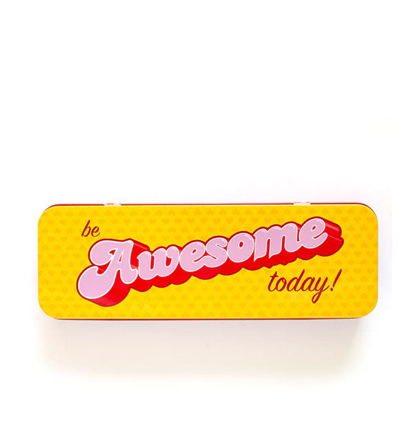Rectangular yellow patterned box lid with rounded corners says, "Be awesome today!" in pink and red lettering of alternating type styles