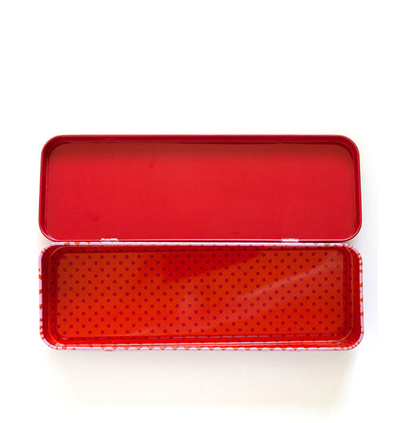 Metal box interior with red lid and red polkadot bottom