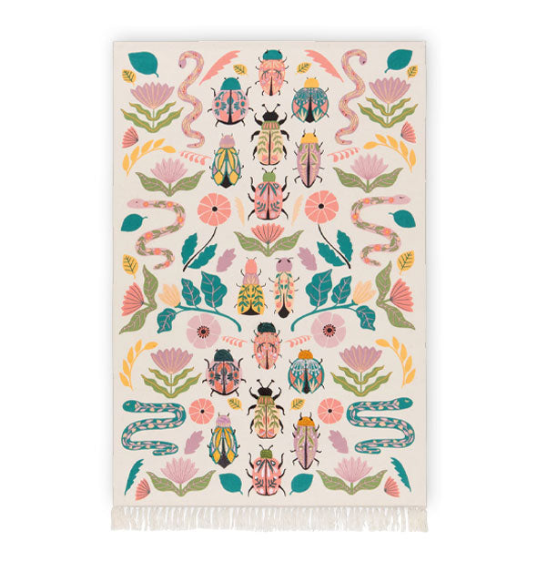 Rectangular white dish towel with bottom tassels features all-over colorful illustrations of beetles, snakes, flowers, leaves, and feathers