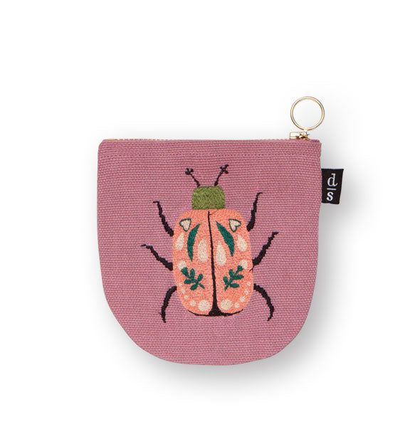 Pink canvas pouch with rounded bottom features colorful scarab beetle embroidery design and a gold zipper pull ring