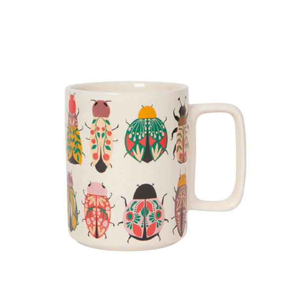 White coffee mug with square handle features all-over colorful and intricate illustrations of beetles and other insects
