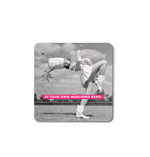 Square magnet with rounded corners features retro black and white image of a majorette bending backward against a field and sky backdrop with the caption, "Be your own marching band."