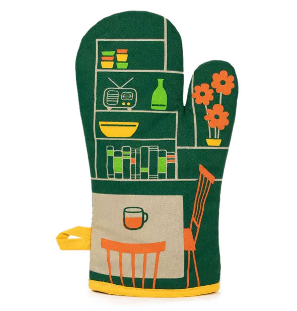 Oven mitt with yellow piping features illustration of a breakfast nook with tea mug on table and items on a shelf