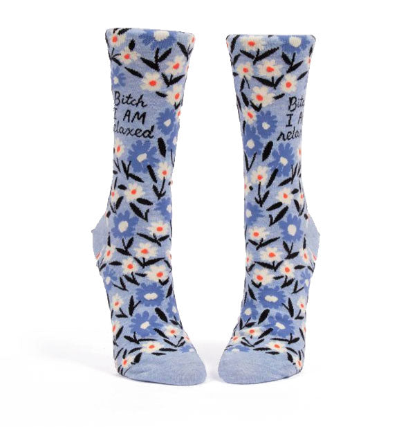 Periwinkle blue crew socks with all-over floral illustration say, "Bitch I AM relaxed"