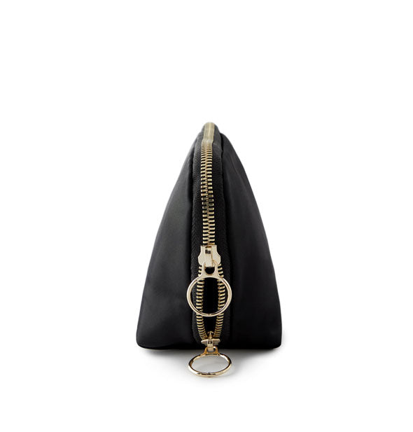 Side view of the triangular Everyday Makeup Bag shows its generous gold zipper with double ring pulls
