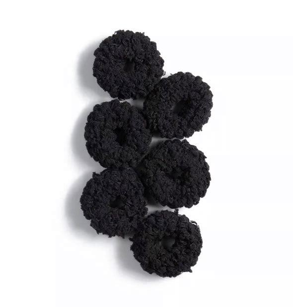 Six black thick fluffy cotton hair scrunchies laid flat