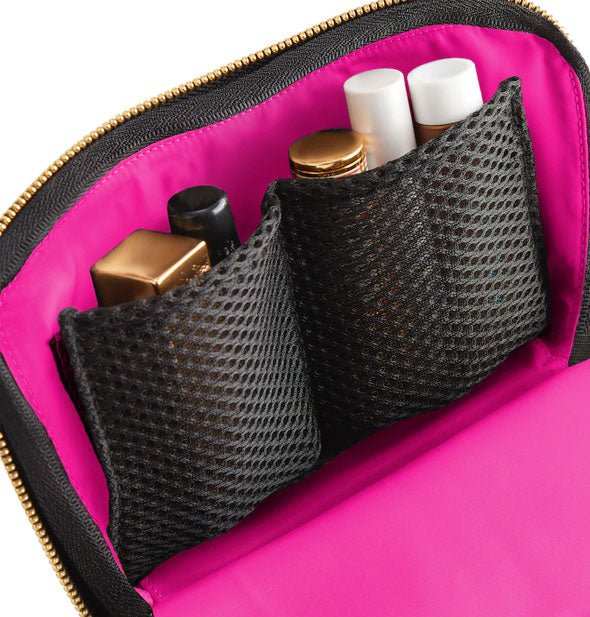 Inside of KUSSHI Everyday Makeup Bag shows pink lining and black mesh slip pockets