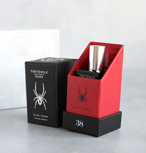 An opened red and black box of TokyoMilk Black Widow Eau de Parfum with bottle inside