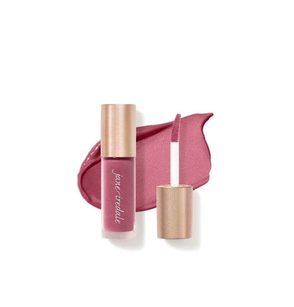 Tube of Jane Iredale Beyond Matte Lip Stain with separate gold doe foot applicator cap rest atop an enlarged sample application of product in shade Blissed-Out