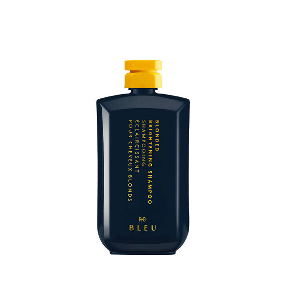 Black faceted bottle of R+Co Bleu Blonded Brightening Shampoo with yellow cap and yellow lettering