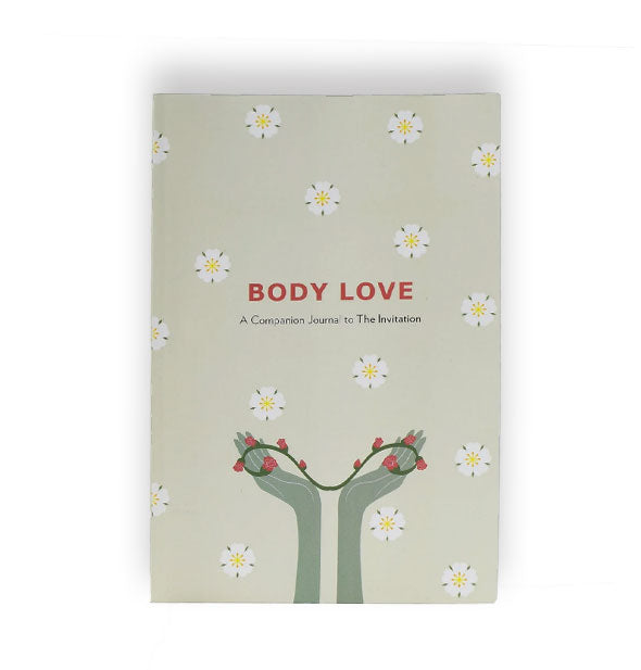 Cover of Body Love: A Companion Journal to he Invitation features hands holding a floral vine graphic and floral print