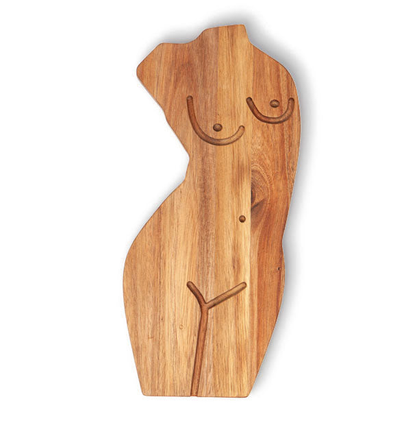 Wooden board is cut in the shape of a woman's torso with grooved breast, belly button, and leg details