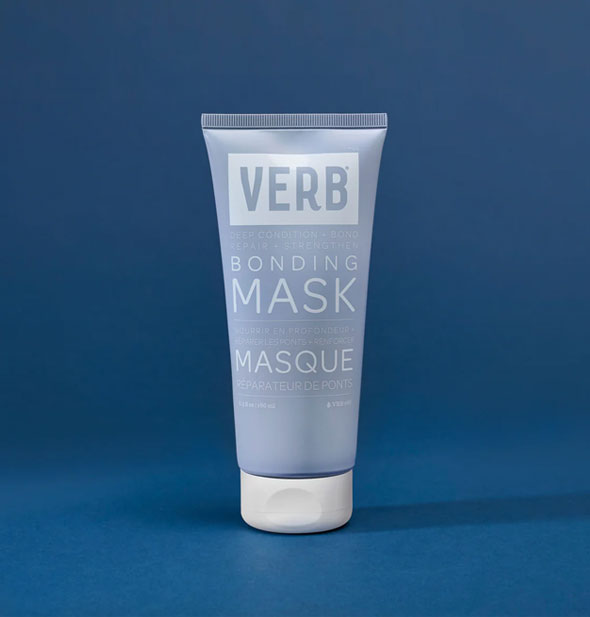 Blue and white 6.3 ounce bottle of Verb Bonding Mask against a dark blue backdrop