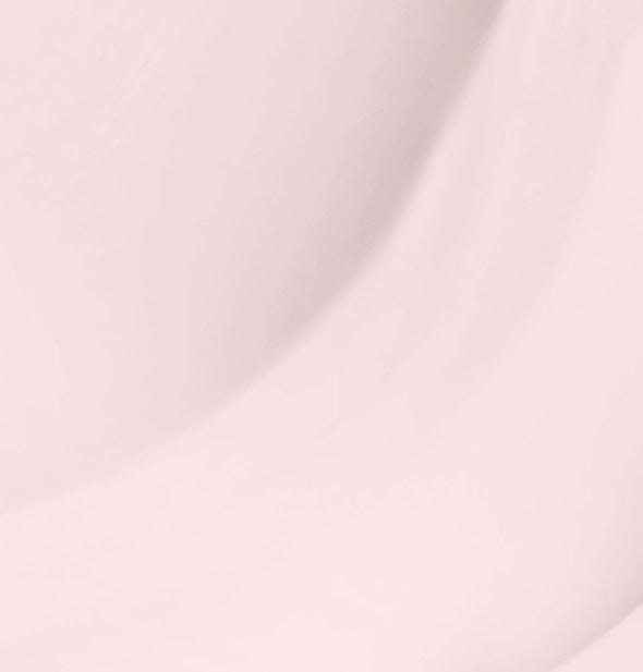 Closeup of very pale pink nail polish