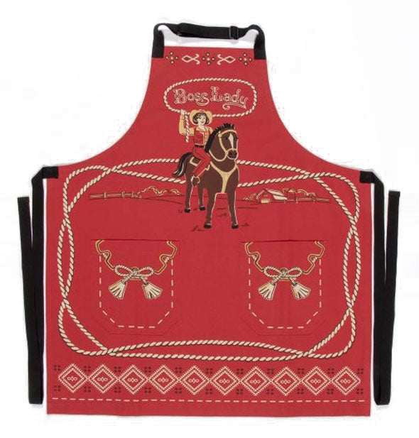 Red apron with black neck and waist straps features illustrated Old West theme with cowgirl lassoing the words, "Boss Lady"
