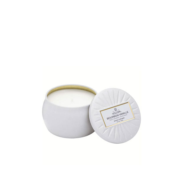 Small white tin candle with embossed lid removed