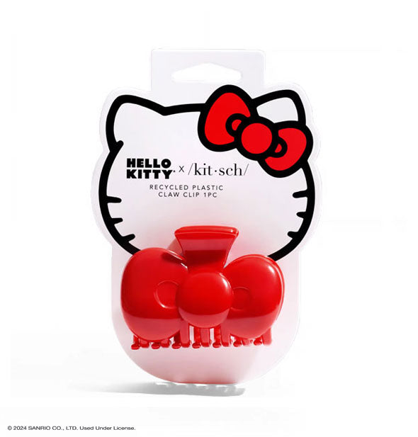 Bright red Hello Kitty bow-shaped claw clip attached to graphic branded product card