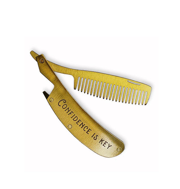 Hinged brass comb features stamping on its sheath that says, "Confidence is key"