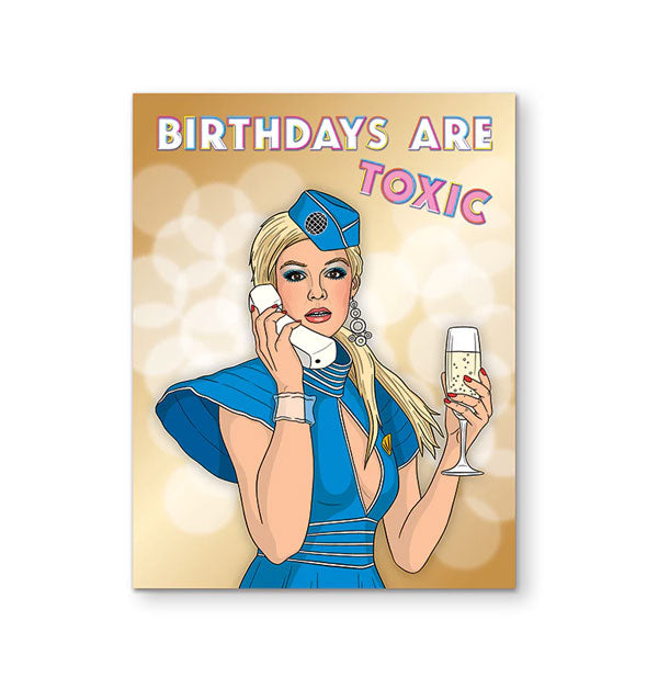 Greeting card featuring illustration of Britney Spears wearing the blue flight attendant costume from the Toxic music video and holding a glass of champagne and white phone says, "Birthdays are toxic" in white and pink lettering at the top