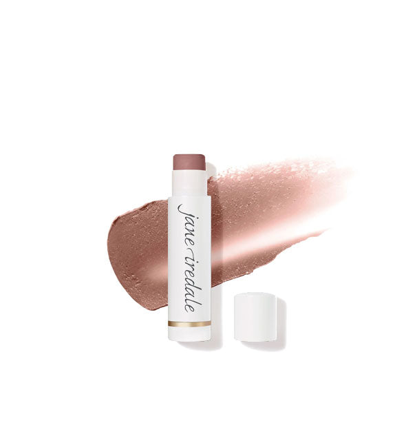 White tube of Jane Iredale lip balm with cap removed overtop a sample application of product in a warm brown shade