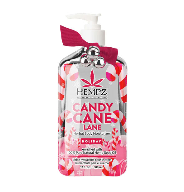 17 ounce bottle of Hempz Candy Cane Lane Herbal Body Moisturizer with silver bells and red ribbon attached and a red and white candy cane label motif