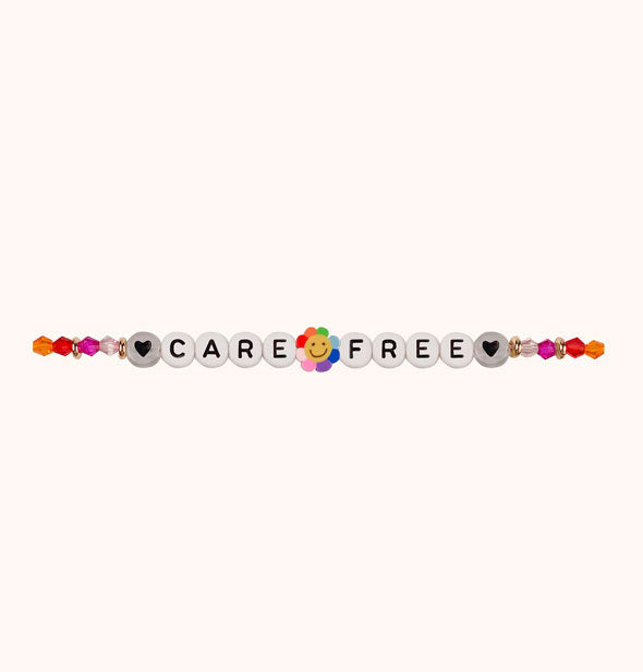 Beaded bracelet with hearts, rainbow smiley, and other accent beads spells out, "Care Free"
