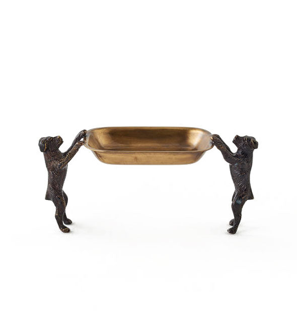 Soap dish consisting of two cast iron dog figurines on hind legs supporting a brass dish with their front paws