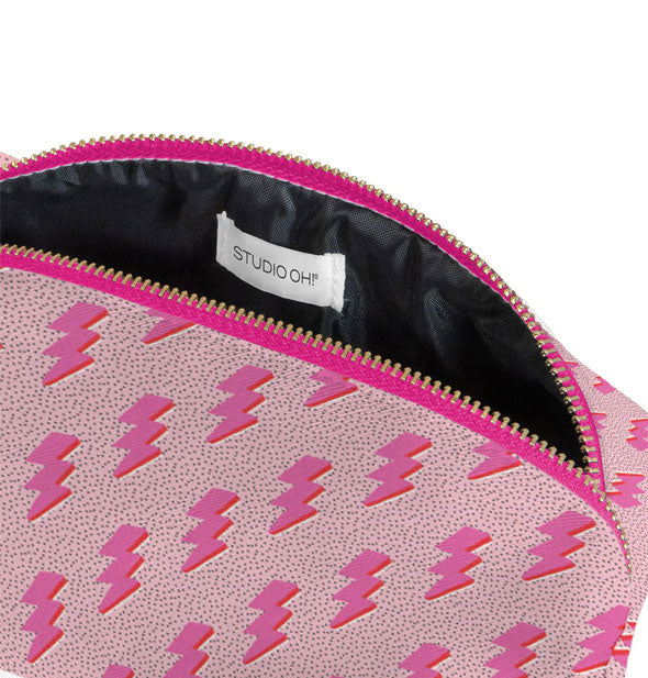 Unzipped pink lightning bolt pouch reveals black interior lining with sewn-in Stufio Oh! label