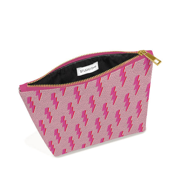 Pink lightning bolt print pouch unzipped to show black interior lining with sewn-in Studio Oh! label