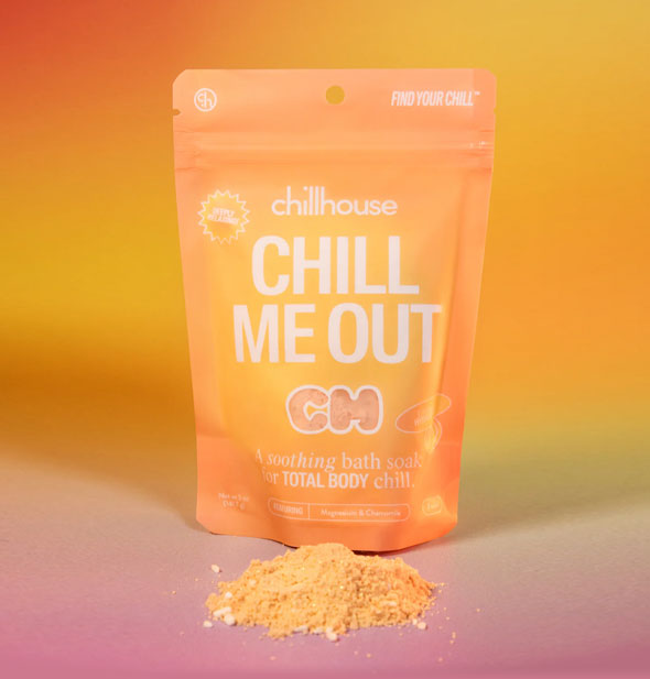 Orange 5 ounce pouch of Chillhouse Chill Me Out bath soak with a small pile of powdery orange contents in front