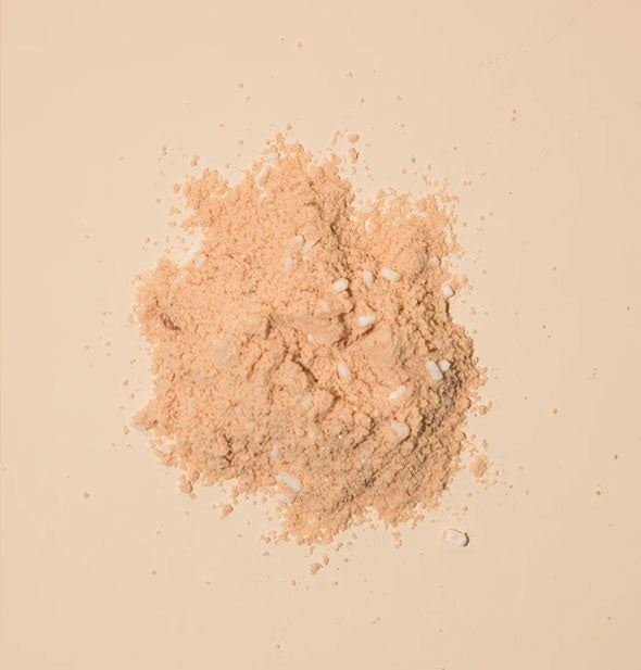 Pile of orange powder bath soak with granules