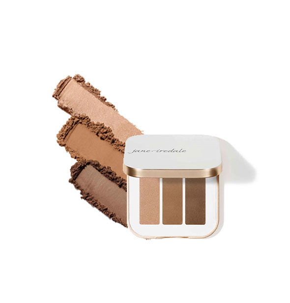 Opened square white and gold Jane Iredale Eye Shadow Triple compact with sample applications alongside in shade combo Cognac