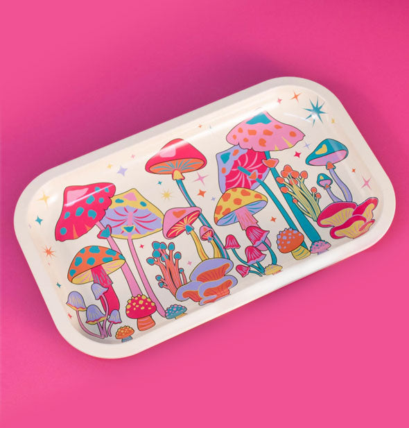 Rectangular white tray with rounded corners features vibrantly colorful, all-over illustrations of mushrooms accented by stars