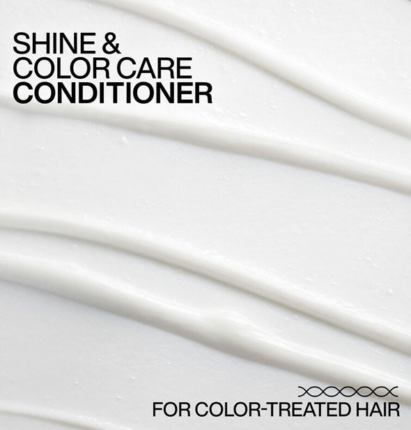 Closeup of smooth, white Redken Acidic Color Gloss Conditioner with ridges raked through is captioned, "Shine & color care conditioner; For color-treated hair"