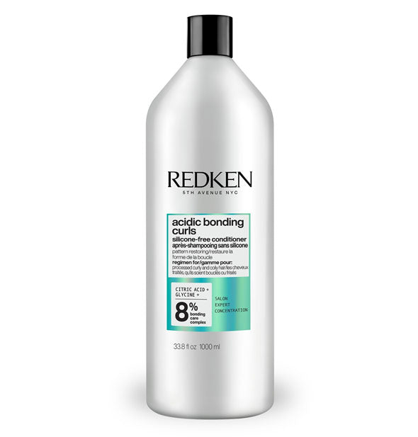 Silvery-white 33.8 ounce bottle of Redken Acidic Bonding Curls Silicone-Free Conditioner with metallic teal spot color and black letteirng