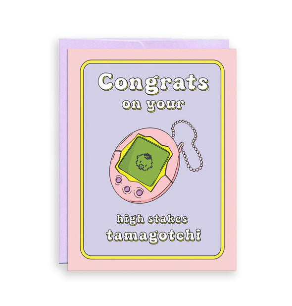 Pink and purple greeting card backed by a purple envelope features illustration of a pink Tamagotchi with green screen printed with a baby's face and the message, "Congrats on your high stakes Tamagotchi" in white lettering