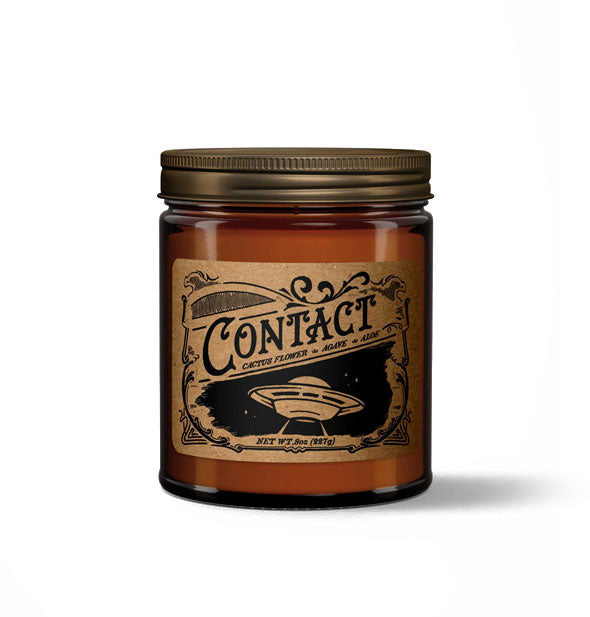 Contact candle in amber glass jar with metal lid features a kraft paper label in a vintage style with spaceship illustration